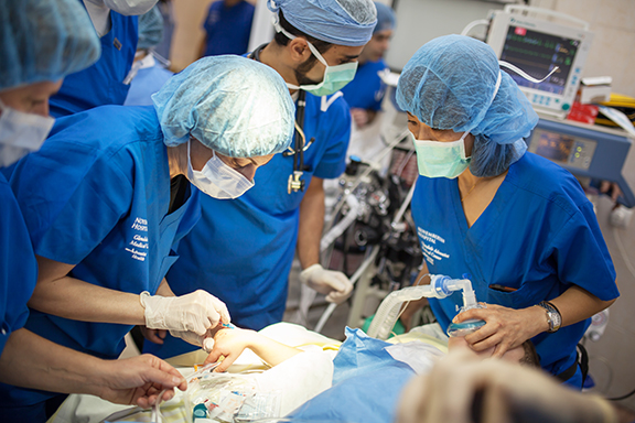 Anesthesiologists Dr. Hasmik Akopyan and Dr. Robin Kim prepare a pediatric patient for oral surgery.