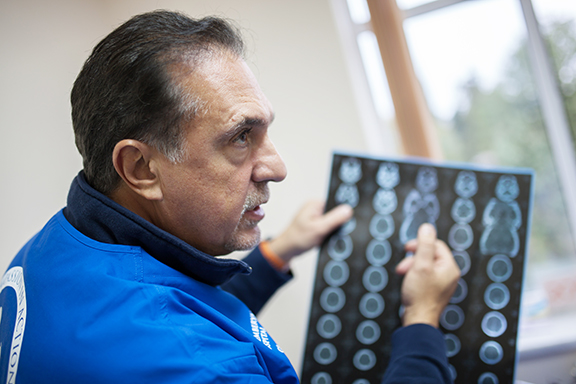 Neurologist Dr. Armen Cherik reviews the brain scan of a recent trauma patient.