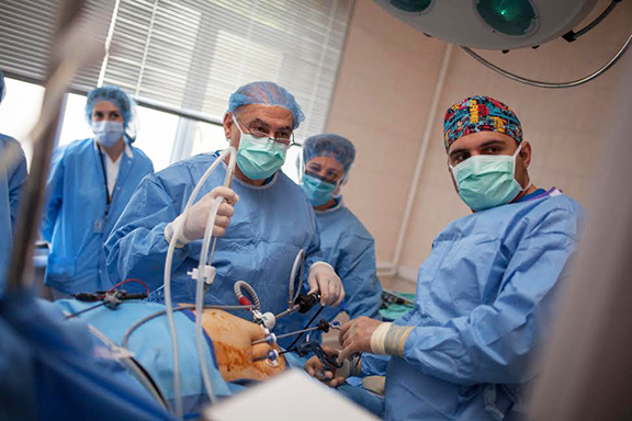 General and vascular surgeon Dr. Simon Keushkerian and Dr. Karo Davtyan perform laparascopic surgery at the Noyemberyan Hospital