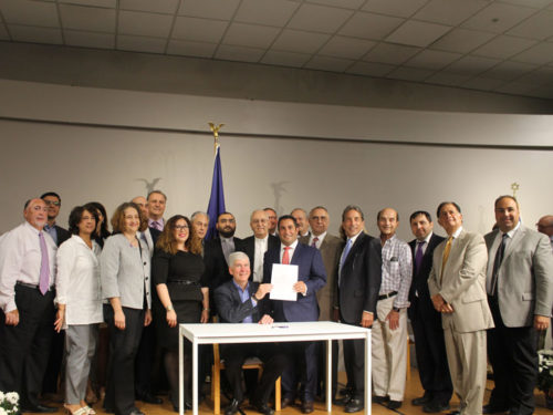 Gov Rick Snyder signing into law HB4493, requiring genocide education in Michigan public schools, including education on the Armenian Genocide and Jewish Holocaust.