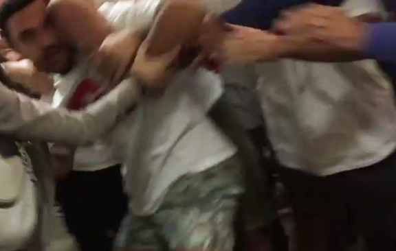 Peaceful protester being pushed by audience member (Photo: Screenshot/AYF Facebook Video)