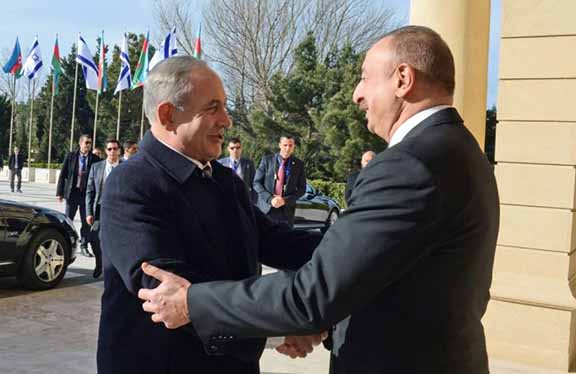 Azerbaijani President Ilham Aliyev (right) greets Israeli Prime Minister Benjamin Netanyahu in Baku on Dec. 13