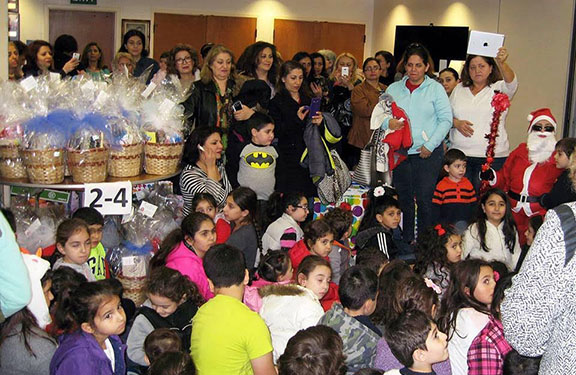 Children and youth of all ages, gathered to receive toys and gift baskets in celebration of the New Year and Christmas at the ARS Regional Headquarters in Glendale, California.