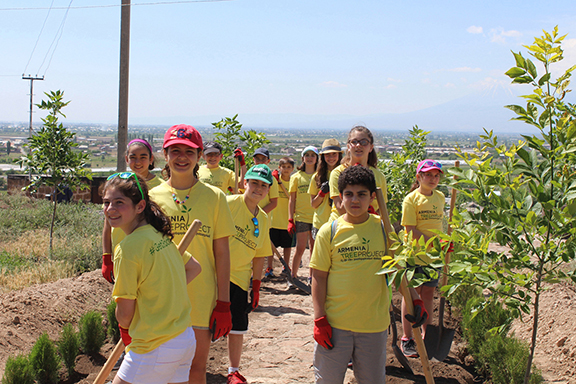 ATP's environmental education program reaches thousands of students every year, even in the diaspora; fifth graders from St. Stephen's Armenian Elementary School in Watertown are pictured here planting trees in Armenia (Photo: Armenia Tree Project)