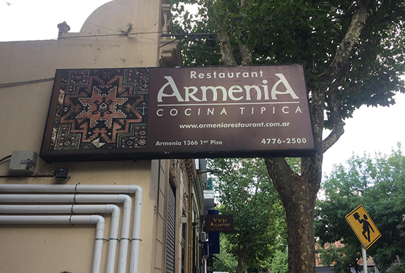 A sign of Armenia restaurant on Armenia street