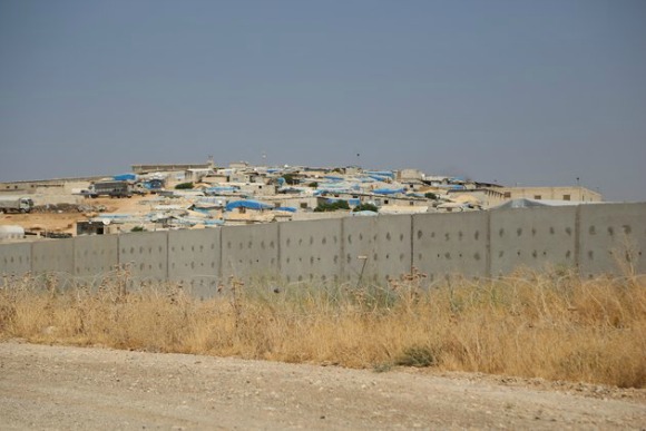 A 3-meter-high and 2-meter-wide wall sits along the Turkish-Syrian border on Aug. 13, 2015, as taken from Hatay, Turkey. (Photo: Cem Genco/Anadolu Agency/Getty Images)