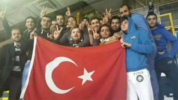 Riyadi fans posing with one of the Turkish flags (photo: Youssef Amin/Twitter)
