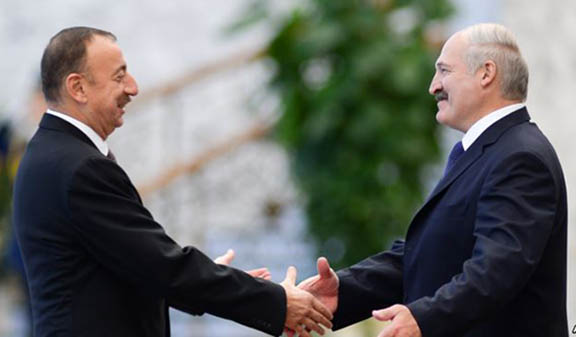 Azeri President Ilham Aliyev greets Belarus President Alexander Lukashenko in 2014